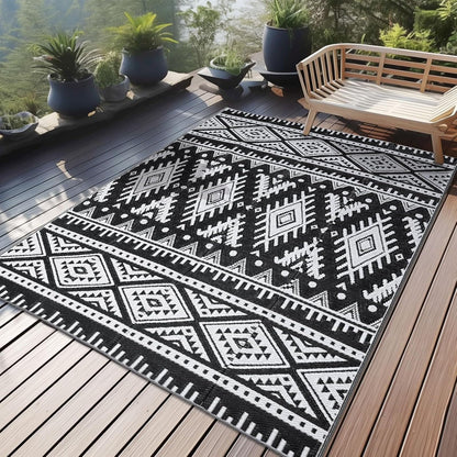 OLANLY Waterproof Outdoor Rug 4x6 ft, Reversible Plastic Straw Patio Camping Rugs, Large Foldable Outdoor Carpet Deck Rugs for Patio, RV, Outside Entry, Backyard, Bench, Picnic, Black & White